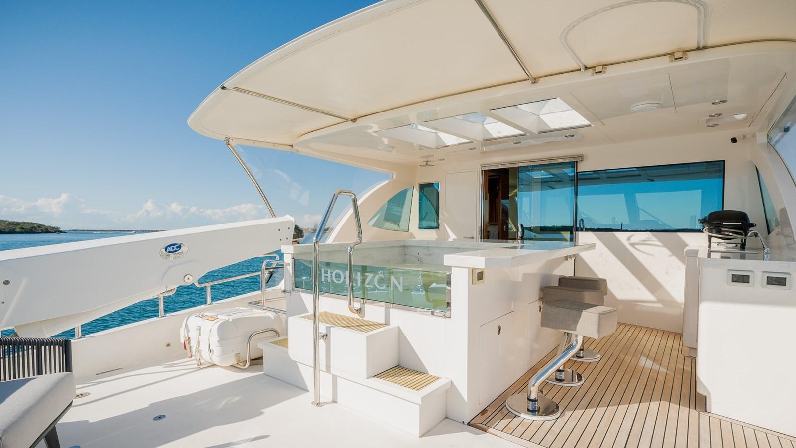 a room with a pool and a deck aboard OHANA Yacht for Sale