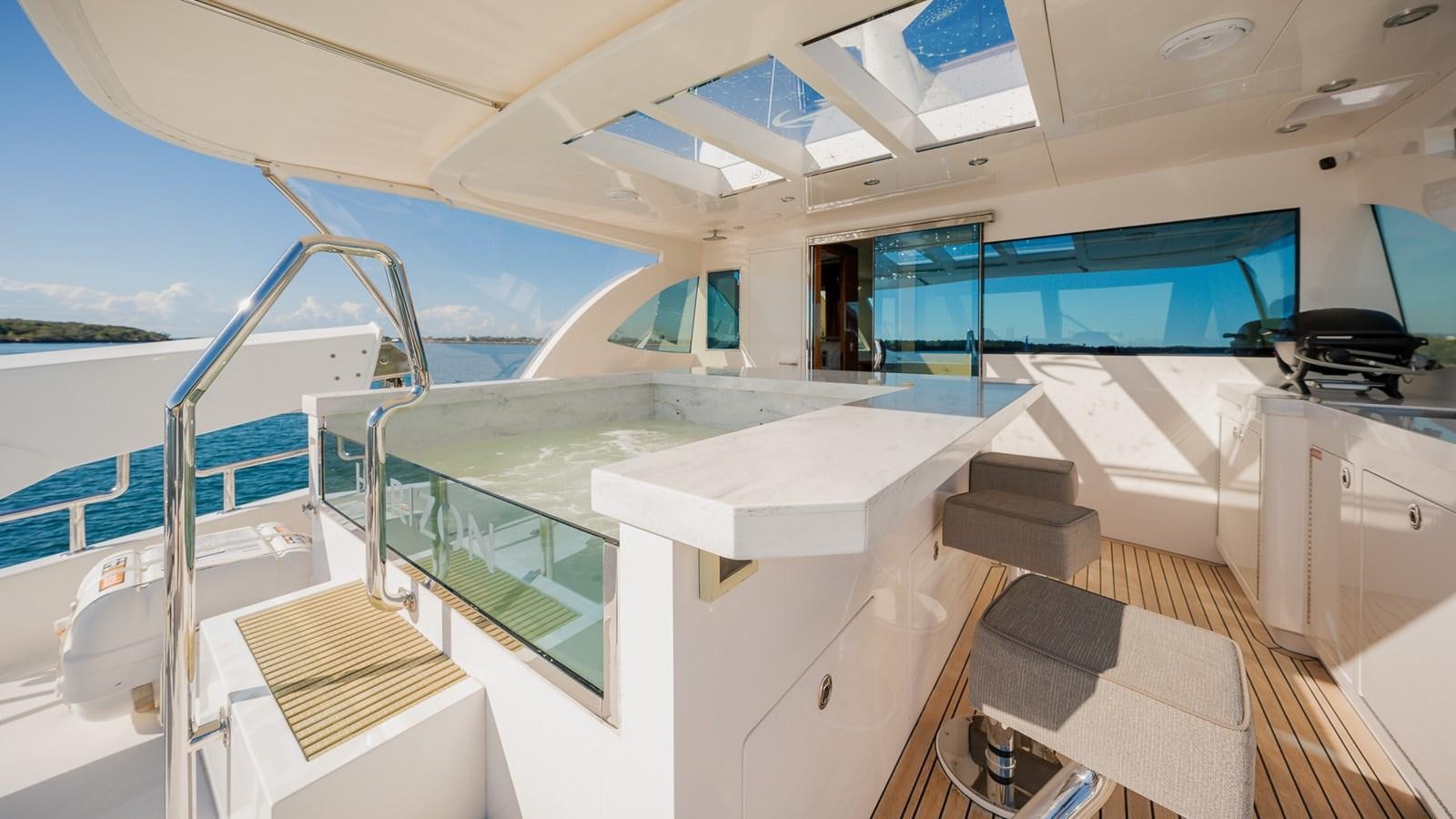 a large open space with a balcony aboard OHANA Yacht for Sale