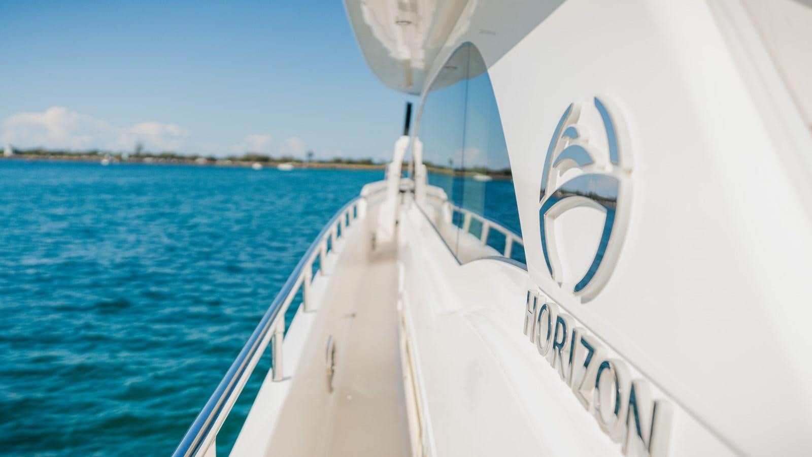 a white boat in the water aboard OHANA Yacht for Sale