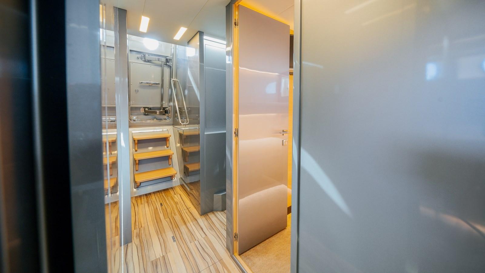 a room with a closet and shelves aboard OHANA Yacht for Sale