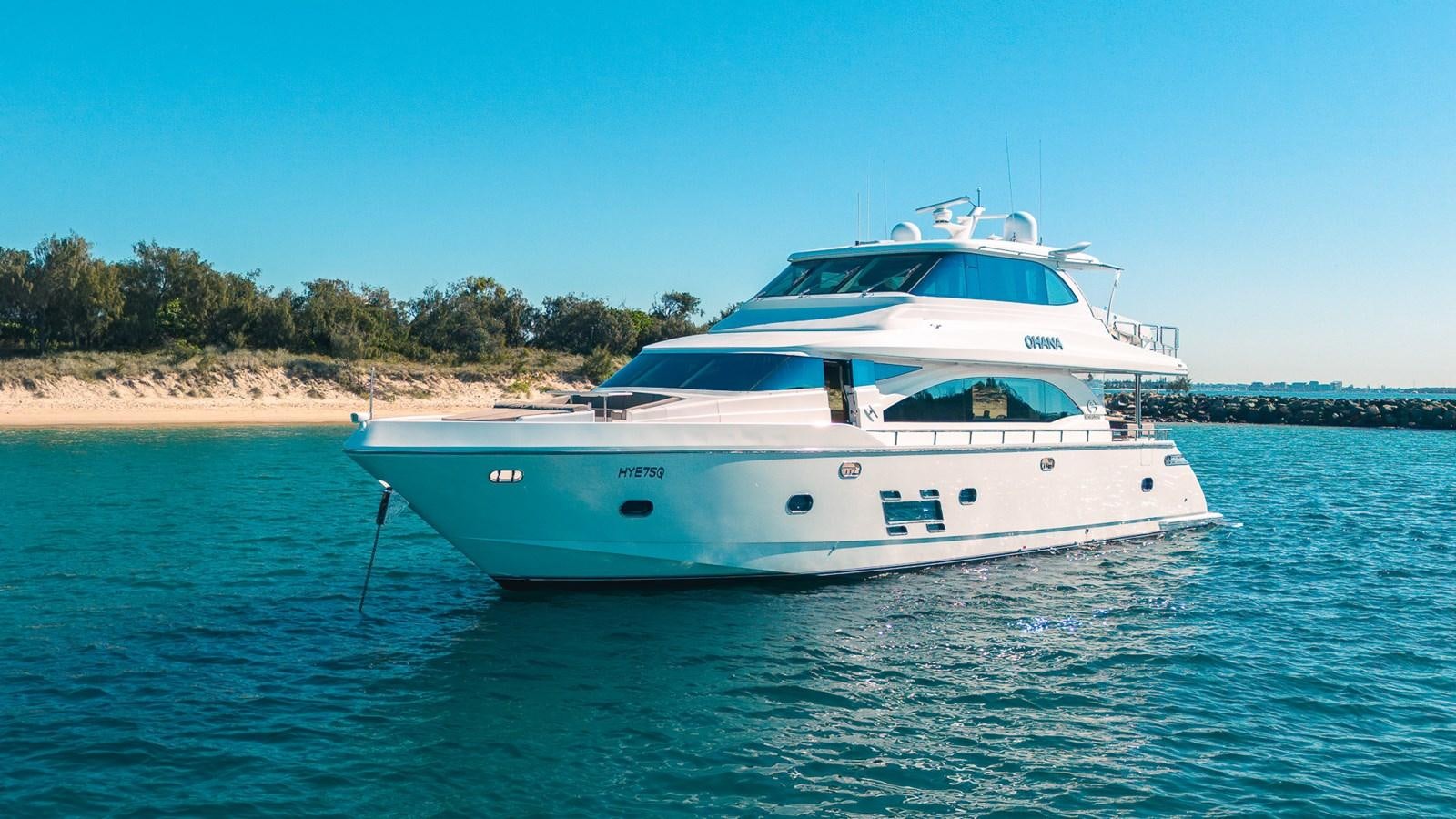 a white yacht on the water aboard OHANA Yacht for Sale