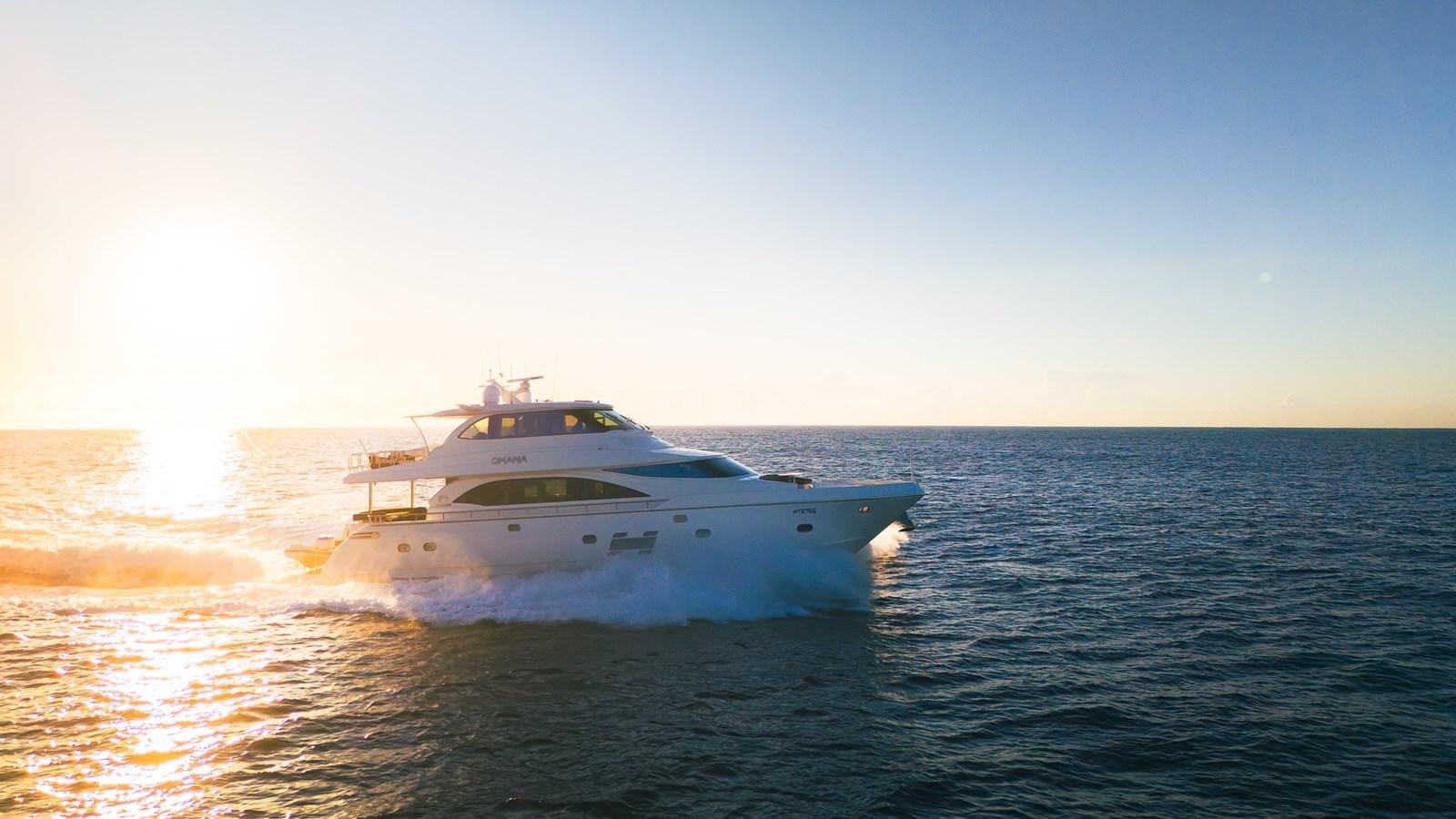 a white yacht in the water aboard OHANA Yacht for Sale