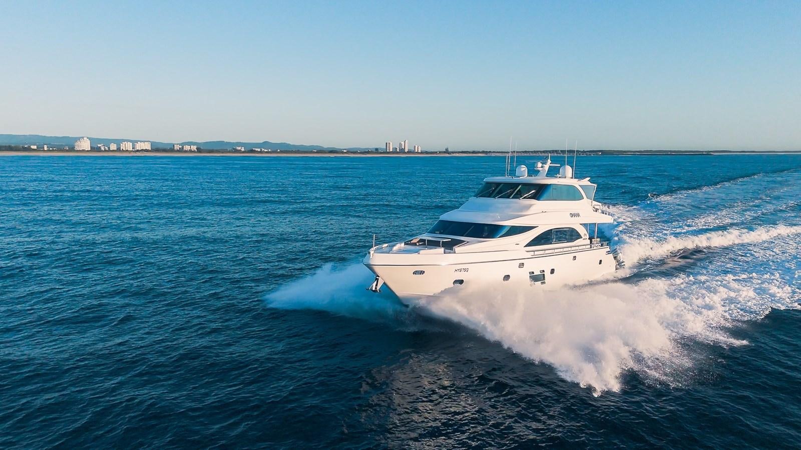 a white yacht on the water aboard OHANA Yacht for Sale