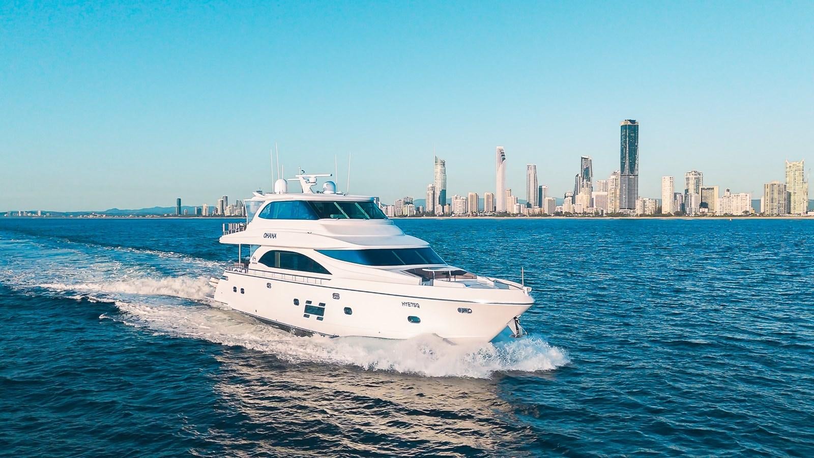a white yacht on the water aboard OHANA Yacht for Sale