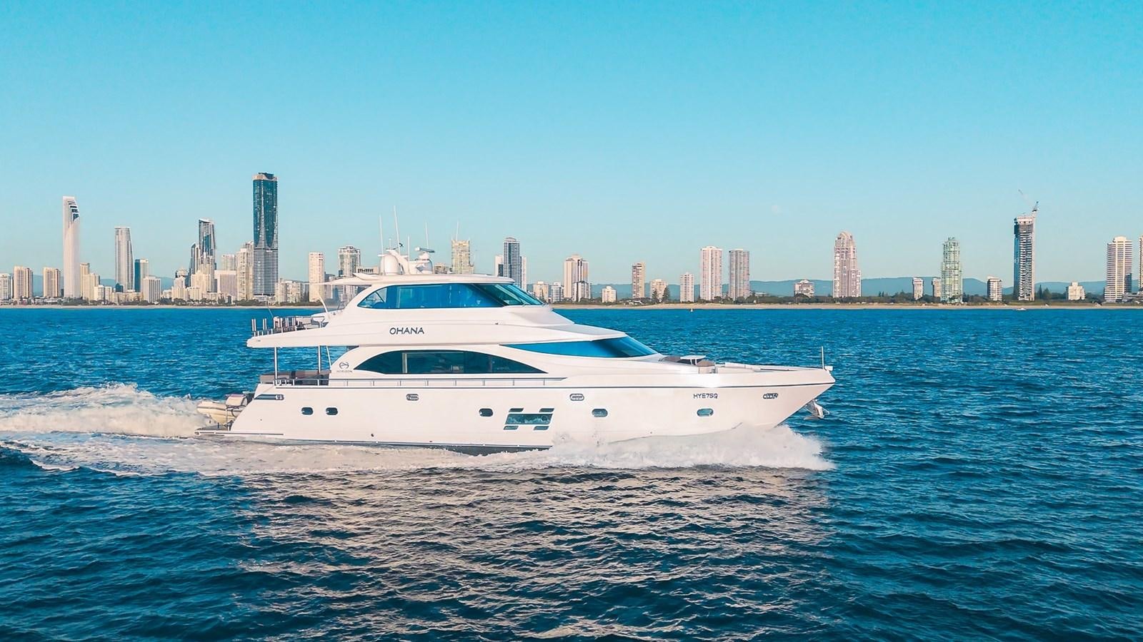 a white yacht on the water aboard OHANA Yacht for Sale