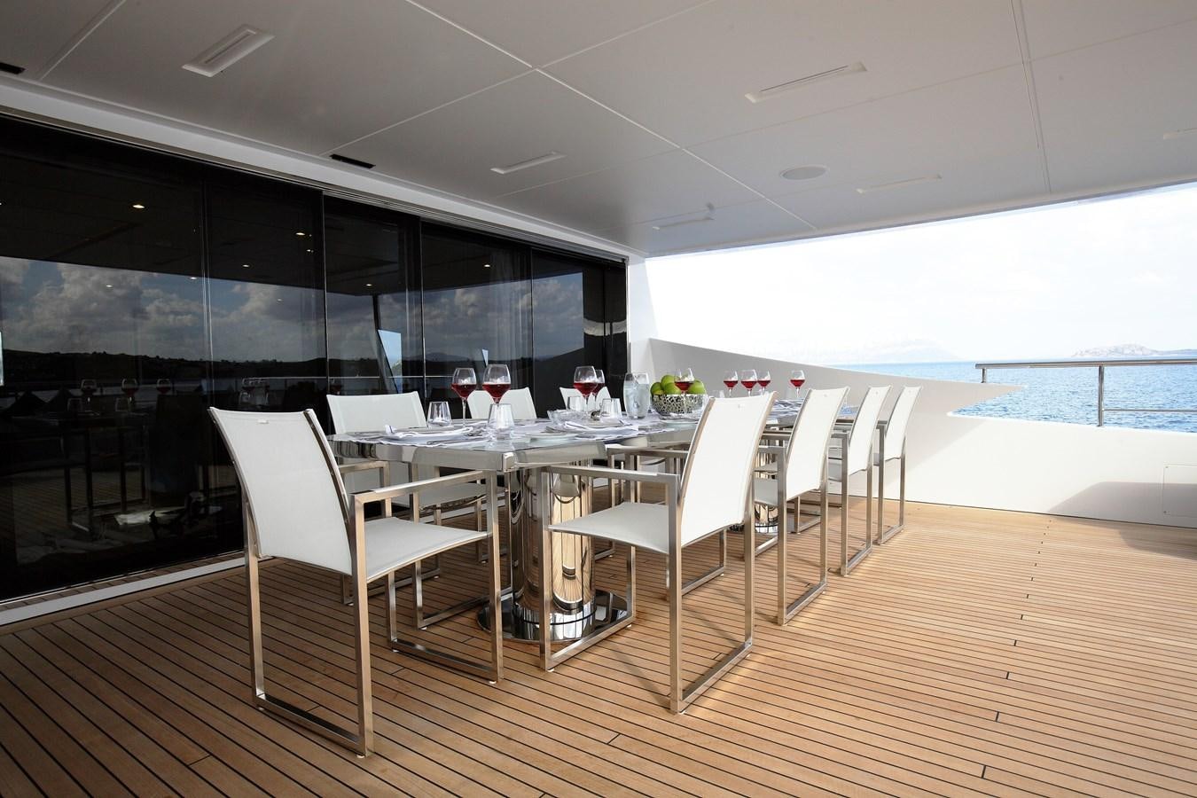 a room with tables and chairs aboard WILLOW Yacht for Sale