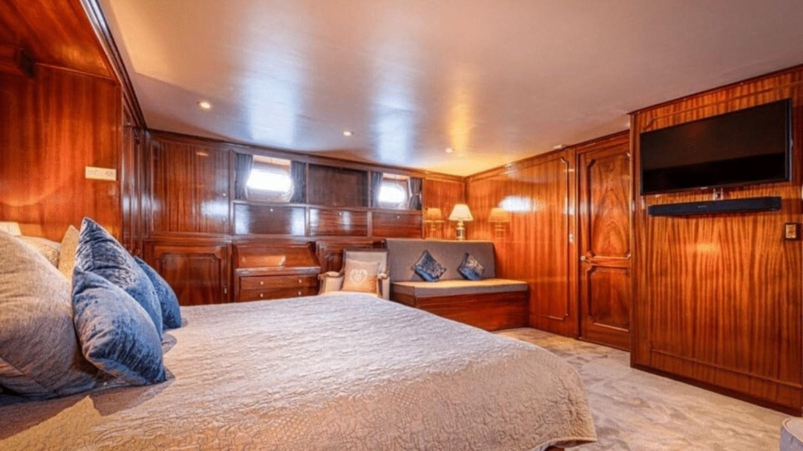 a large bed in a room aboard CHANTELLA Yacht for Sale
