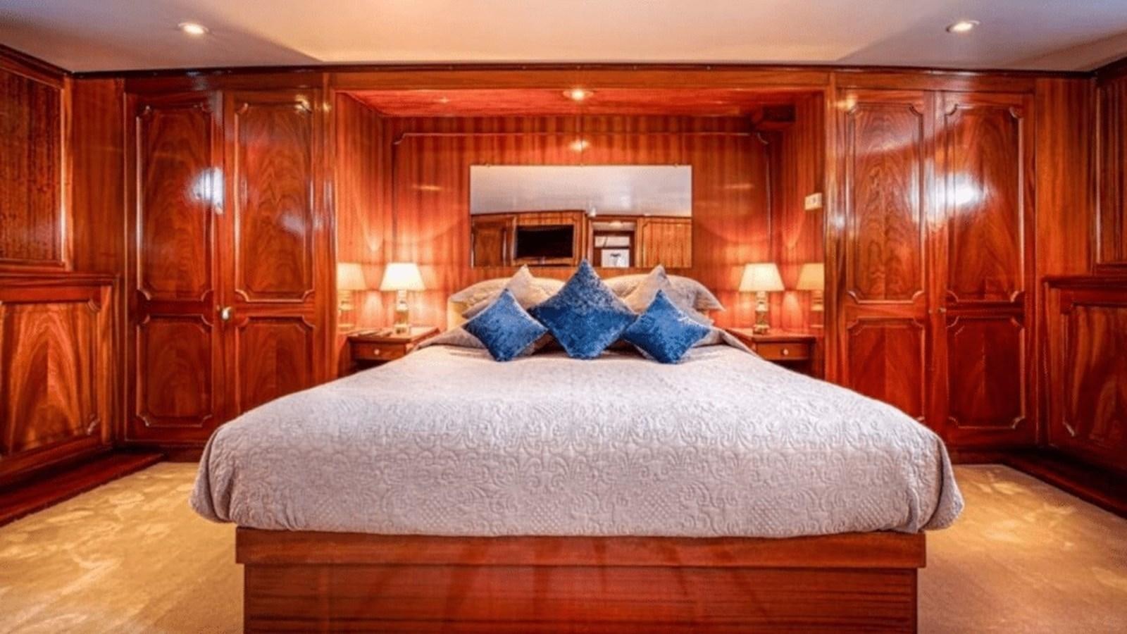 a large bed in a room aboard CHANTELLA Yacht for Sale