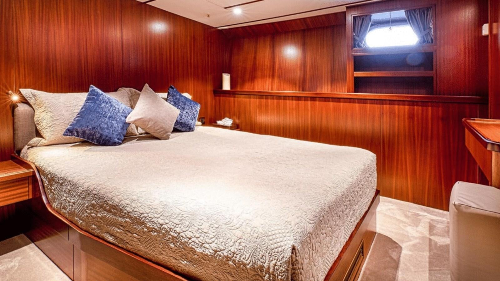 a bed with pillows aboard CHANTELLA Yacht for Sale