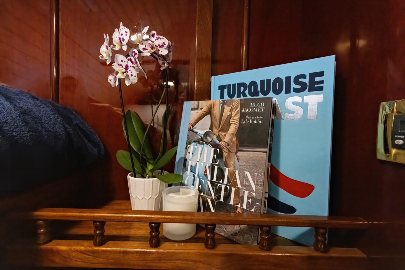 a book on a table aboard HERMITAGE Yacht for Sale