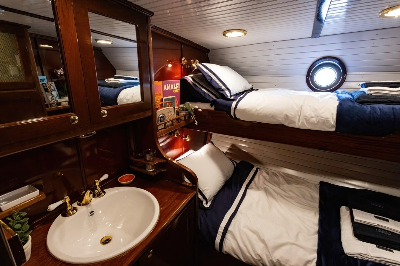 a bathroom with a sink and towels aboard HERMITAGE Yacht for Sale