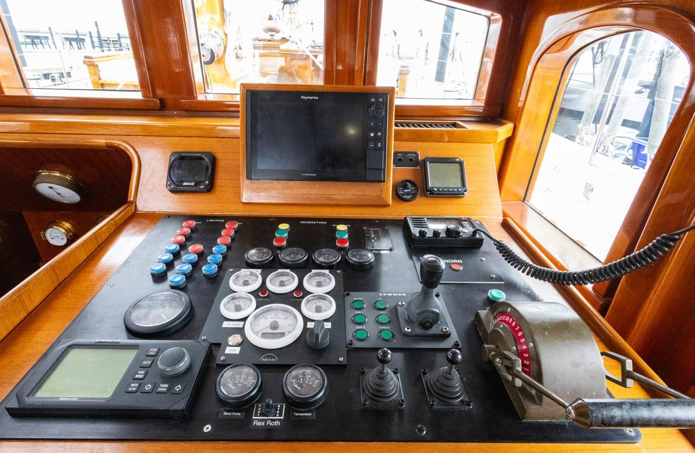 a person sitting in a cockpit aboard HERMITAGE Yacht for Sale