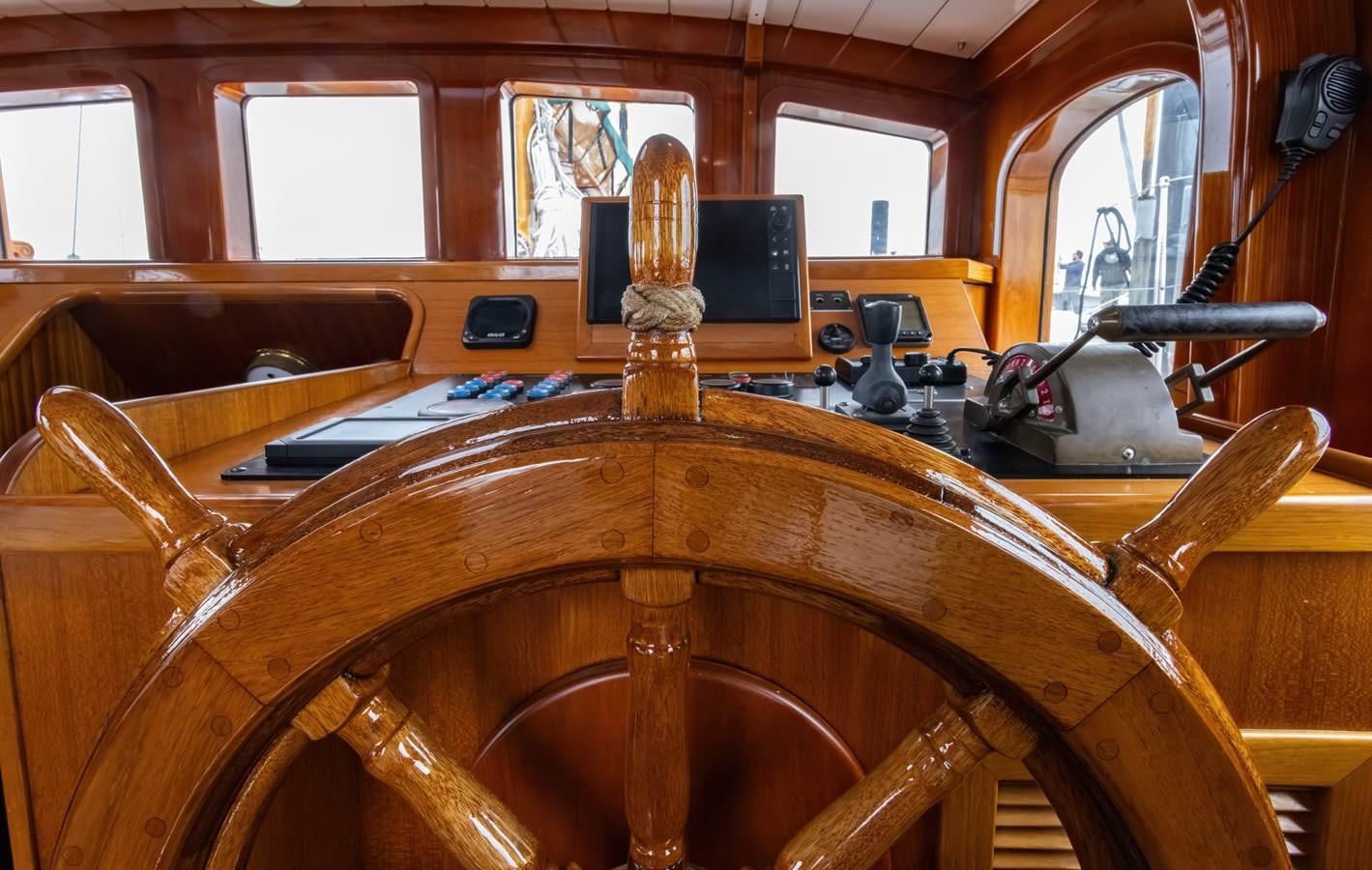 a wooden steering wheel in a room aboard HERMITAGE Yacht for Sale