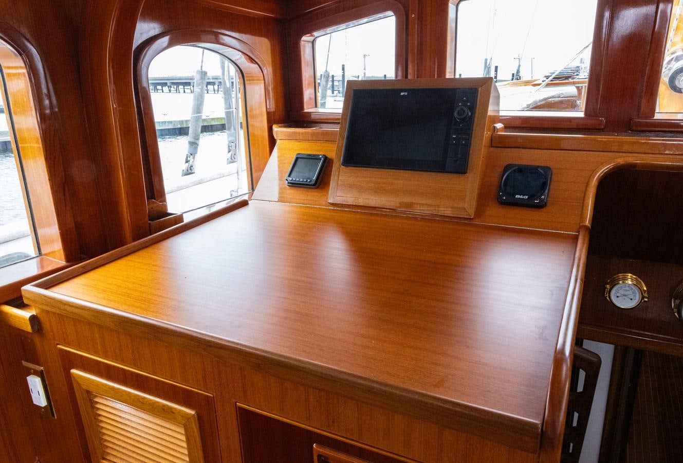 a tv on a table aboard HERMITAGE Yacht for Sale