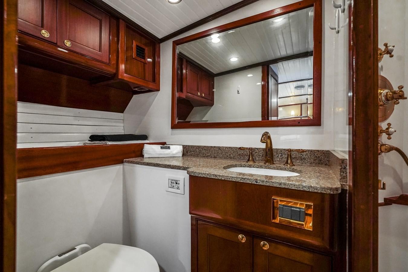 a bathroom with a large mirror aboard HERMITAGE Yacht for Sale