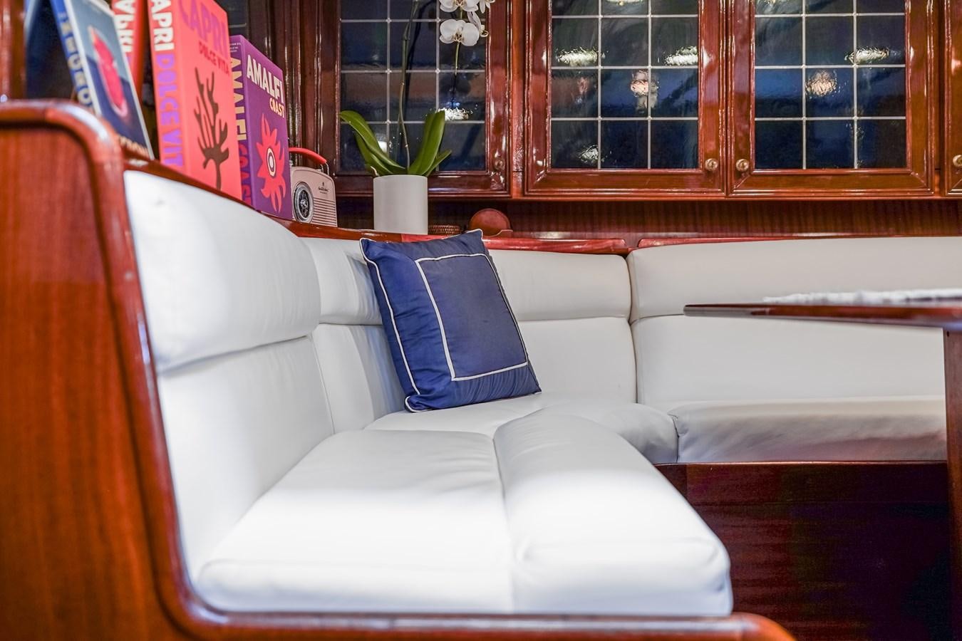 a couch with a plant on the side aboard HERMITAGE Yacht for Sale