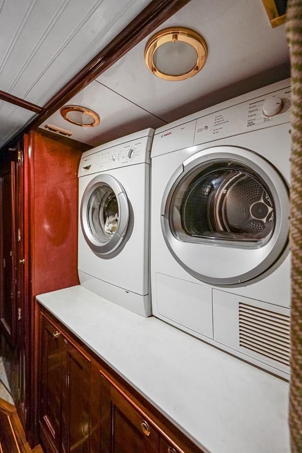 a white washing machine aboard HERMITAGE Yacht for Sale
