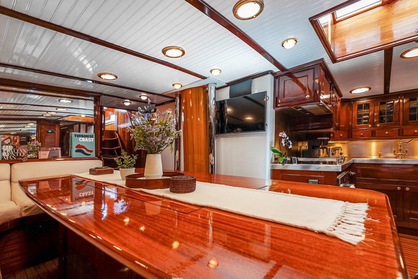 a large kitchen with a large island aboard HERMITAGE Yacht for Sale