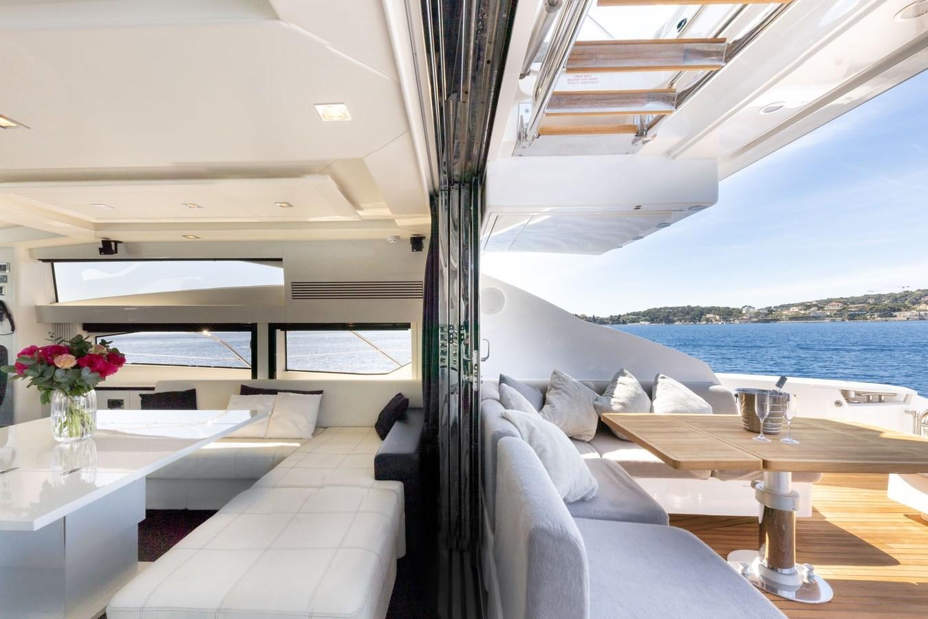 a room with a table and chairs aboard STAR OF SEVEN SEAS Yacht for Sale