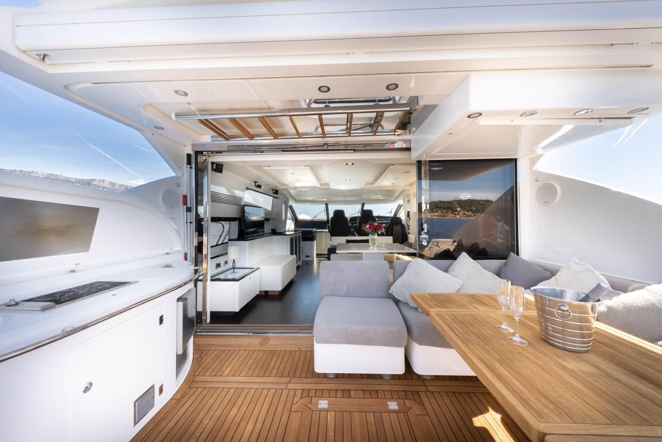 a room with a table and chairs aboard STAR OF SEVEN SEAS Yacht for Sale