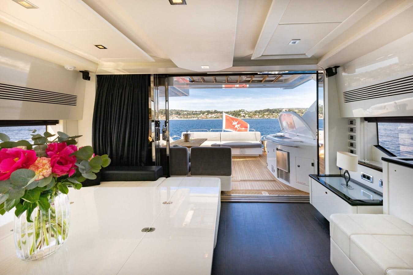 a room with a pool and a balcony aboard STAR OF SEVEN SEAS Yacht for Sale