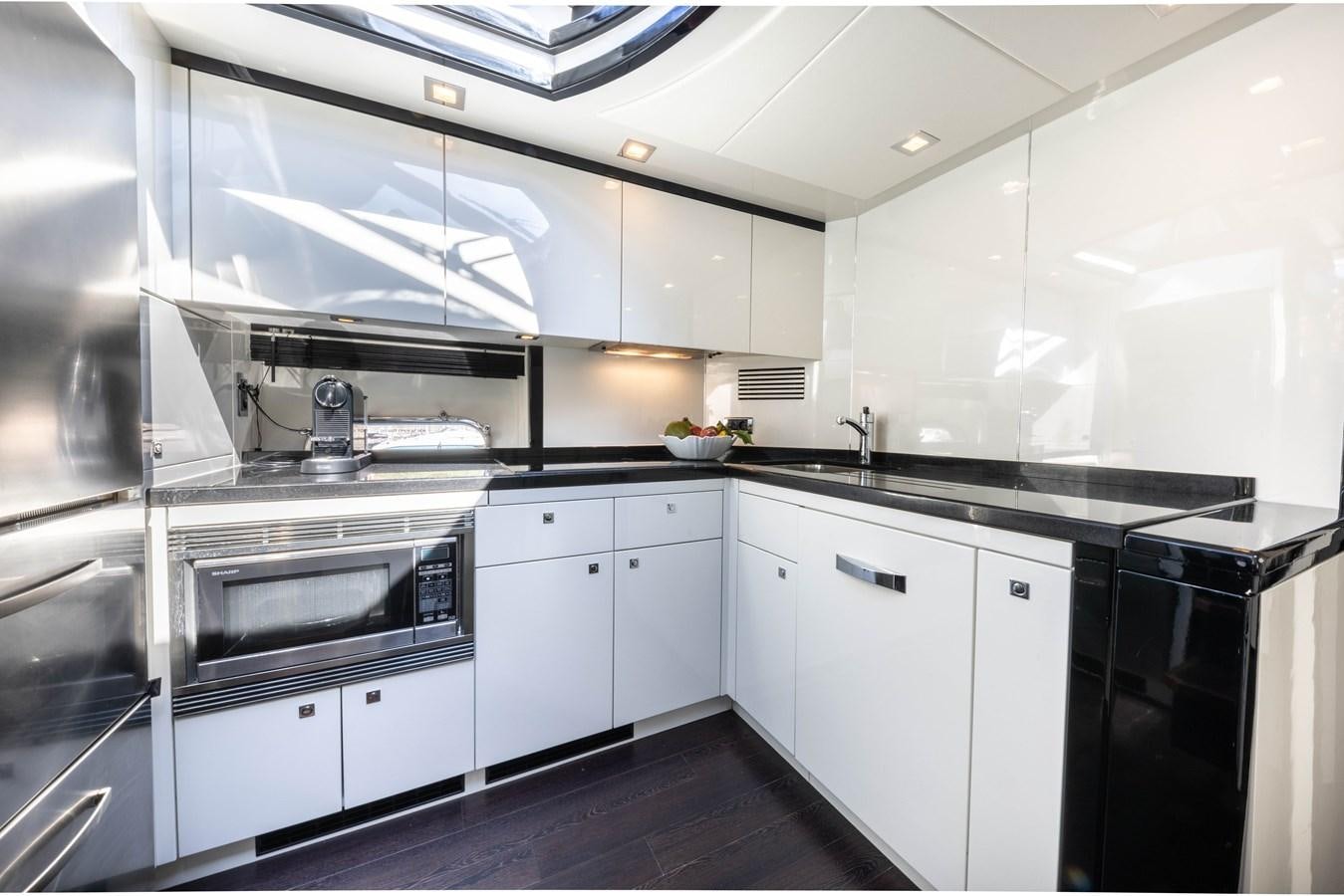a kitchen with white cabinets aboard STAR OF SEVEN SEAS Yacht for Sale