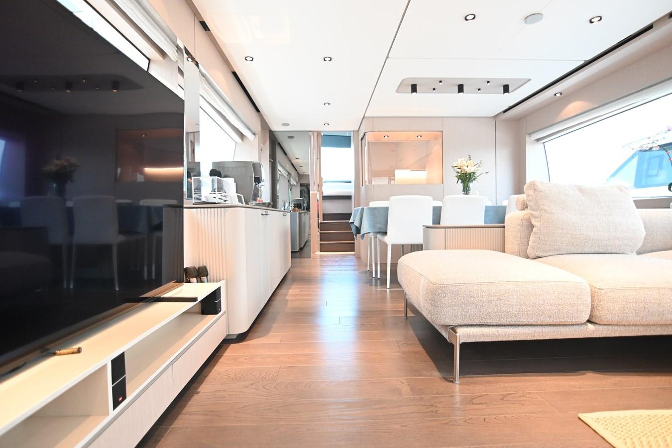 a living room with a wood floor aboard JOYOUS JOURNEY Yacht for Sale