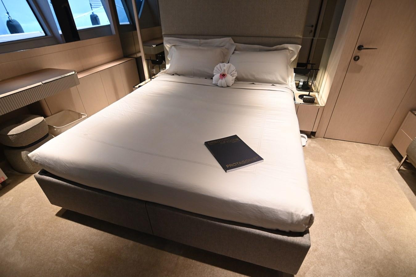 a bed with a laptop on it aboard JOYOUS JOURNEY Yacht for Sale