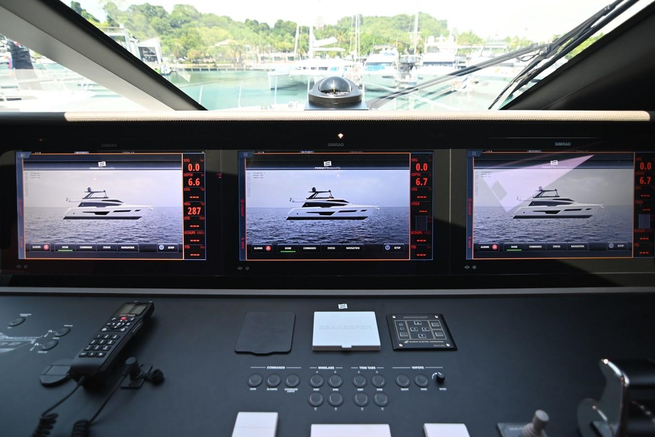 a couple of monitors on a dashboard aboard JOYOUS JOURNEY Yacht for Sale
