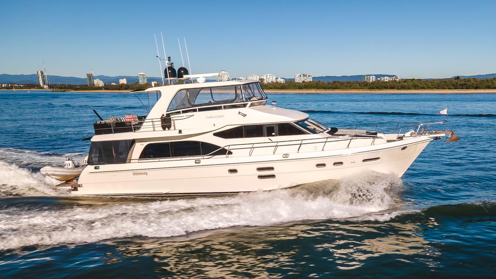 a white yacht on the water aboard CAVALLINO III Yacht for Sale