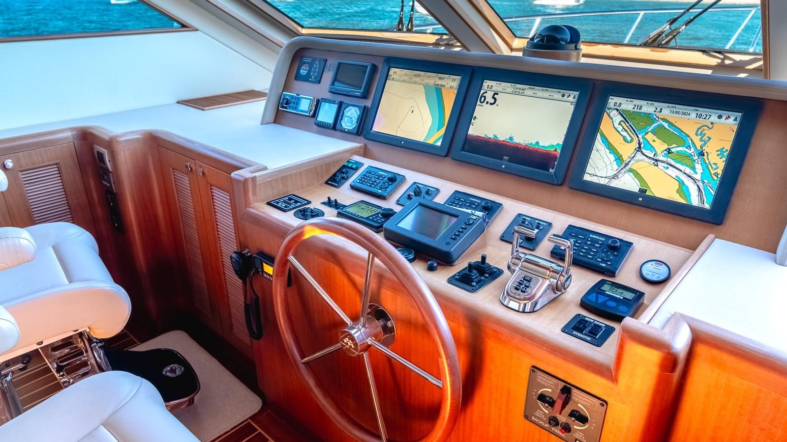 a control room with a large screen aboard CAVALLINO III Yacht for Sale