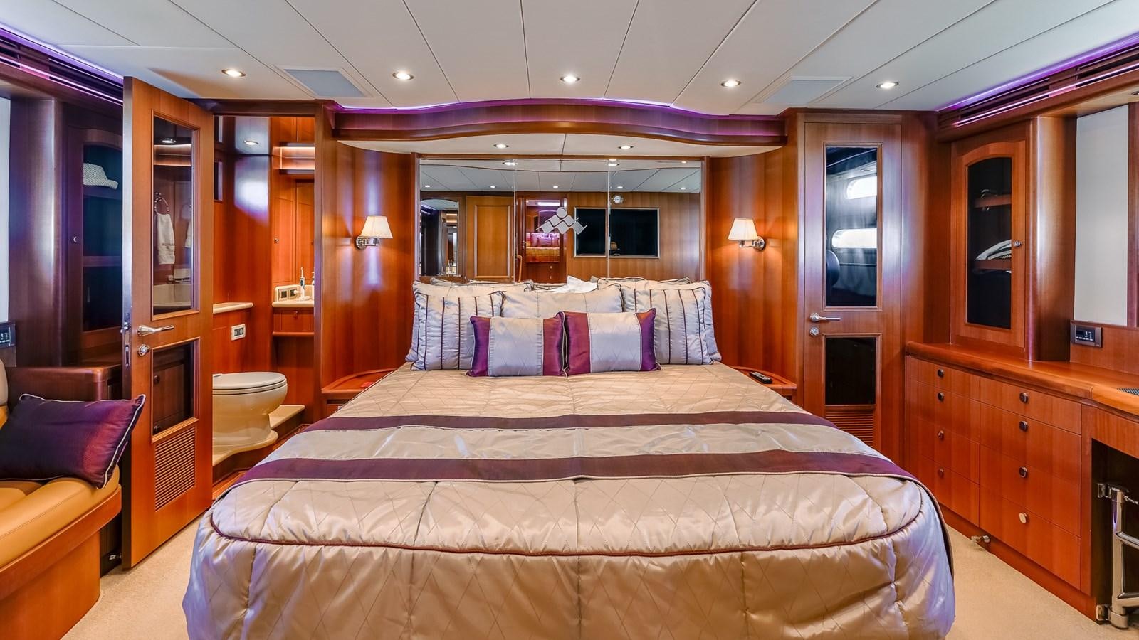 a bed in a room aboard CAVALLINO III Yacht for Sale