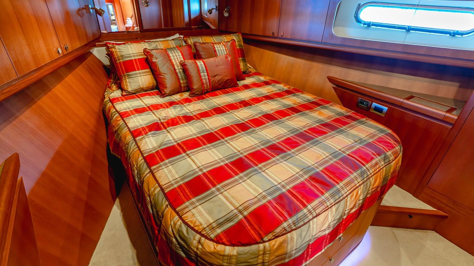a bed in a room aboard CAVALLINO III Yacht for Sale