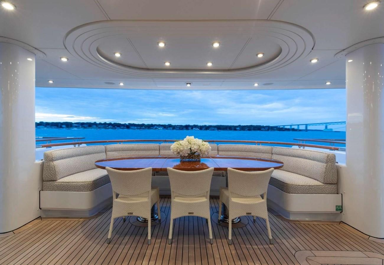a room with a table and chairs aboard BELLA VITA Yacht for Sale