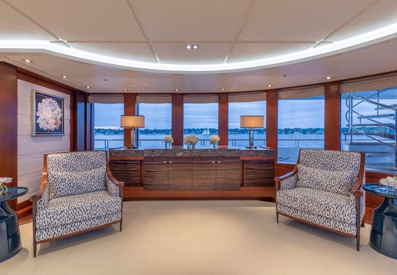a room with a couch and a table and chairs aboard BELLA VITA Yacht for Sale