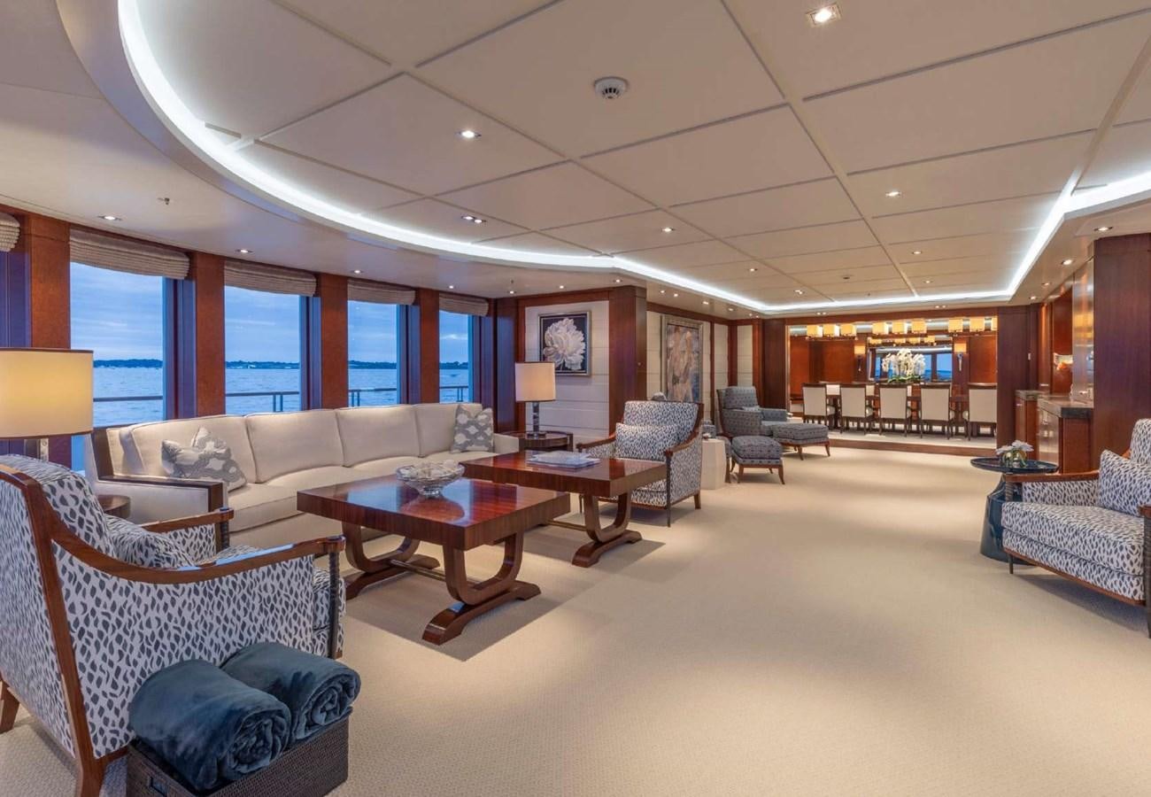 a living room with a large window aboard BELLA VITA Yacht for Sale