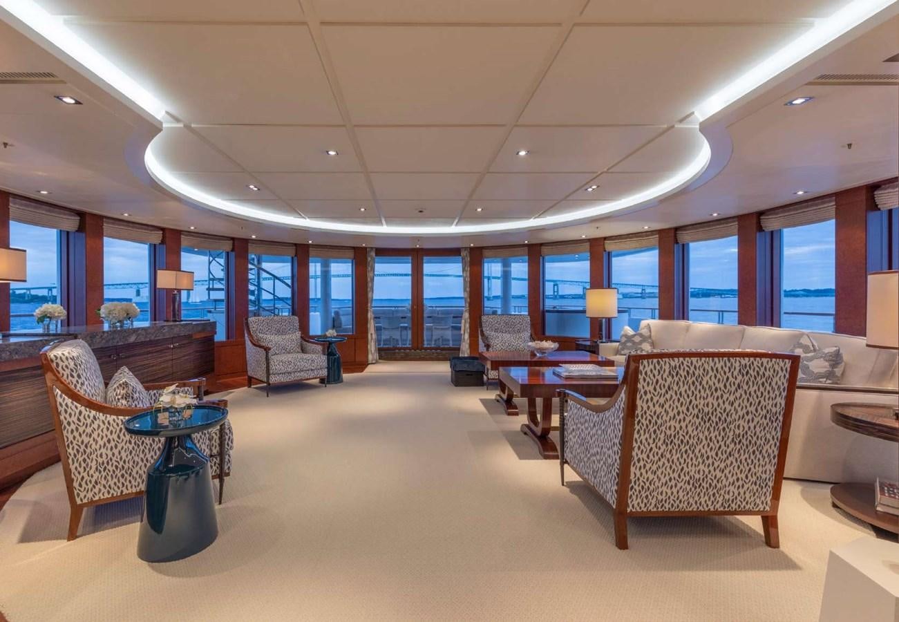 a room with chairs and tables aboard BELLA VITA Yacht for Sale
