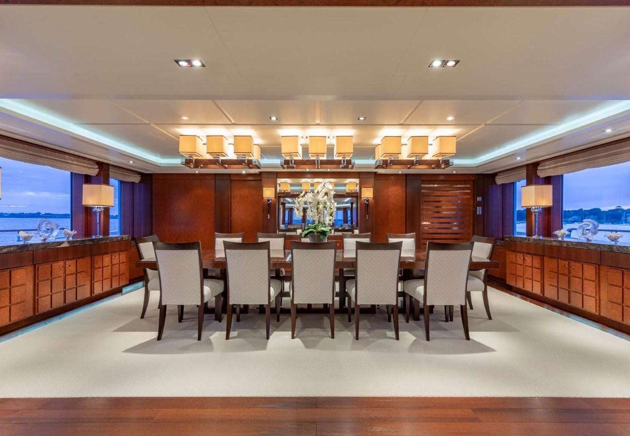 a large room with chairs and a table aboard BELLA VITA Yacht for Sale