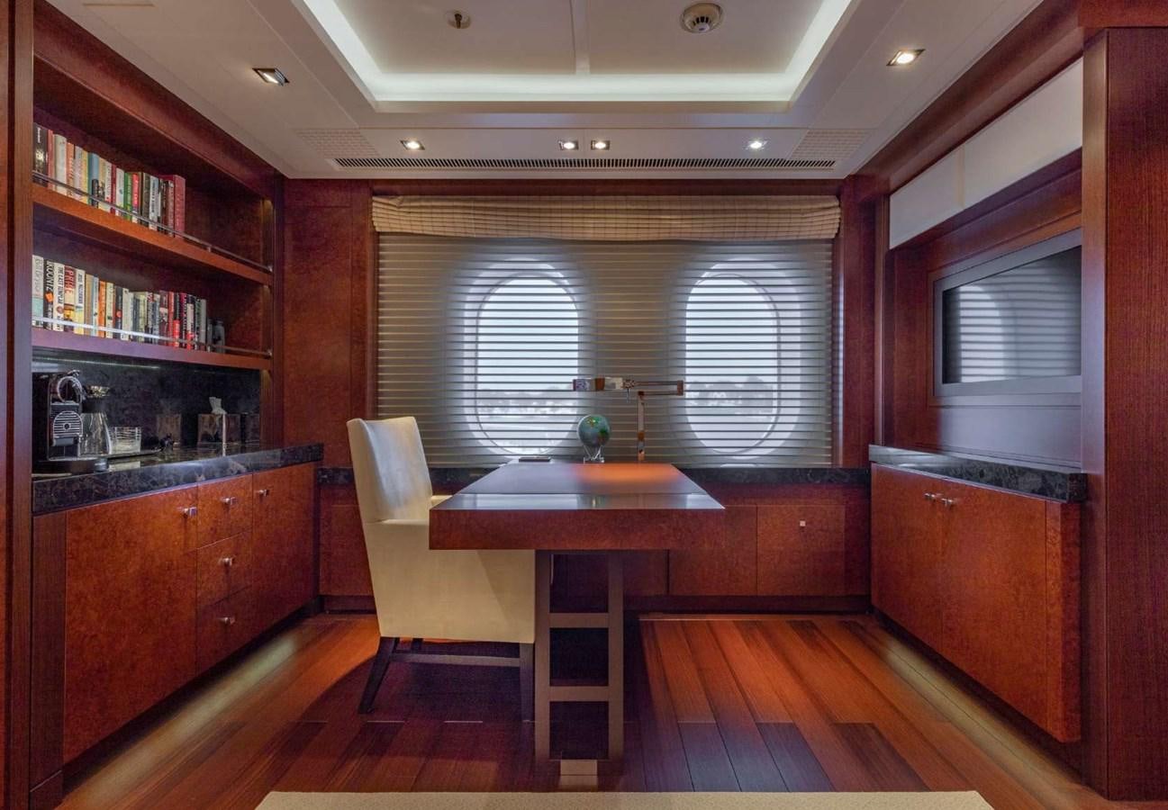 a room with a table and chairs aboard BELLA VITA Yacht for Sale