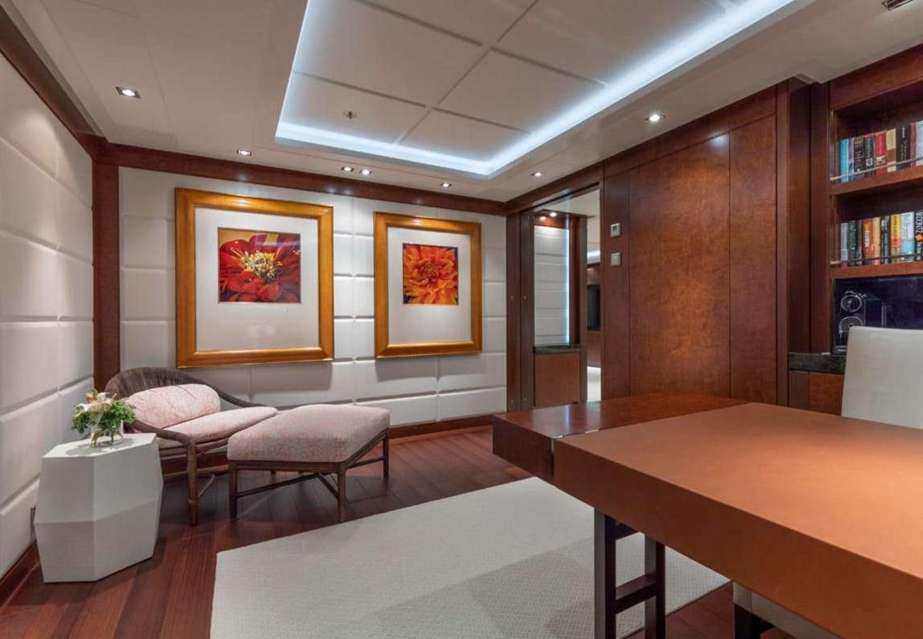 a room with a table and chairs aboard BELLA VITA Yacht for Sale