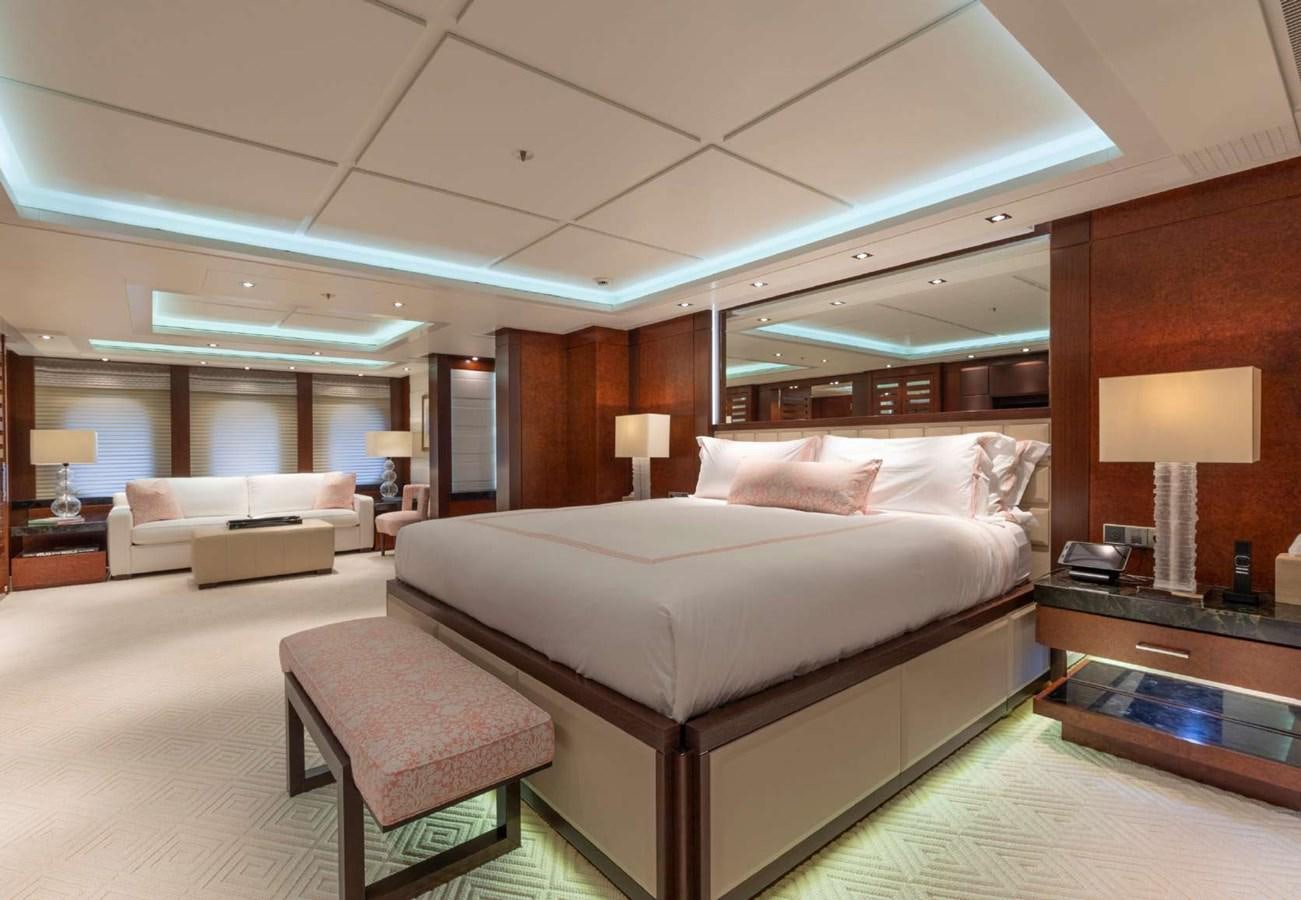 a large bed in a hotel room aboard BELLA VITA Yacht for Sale