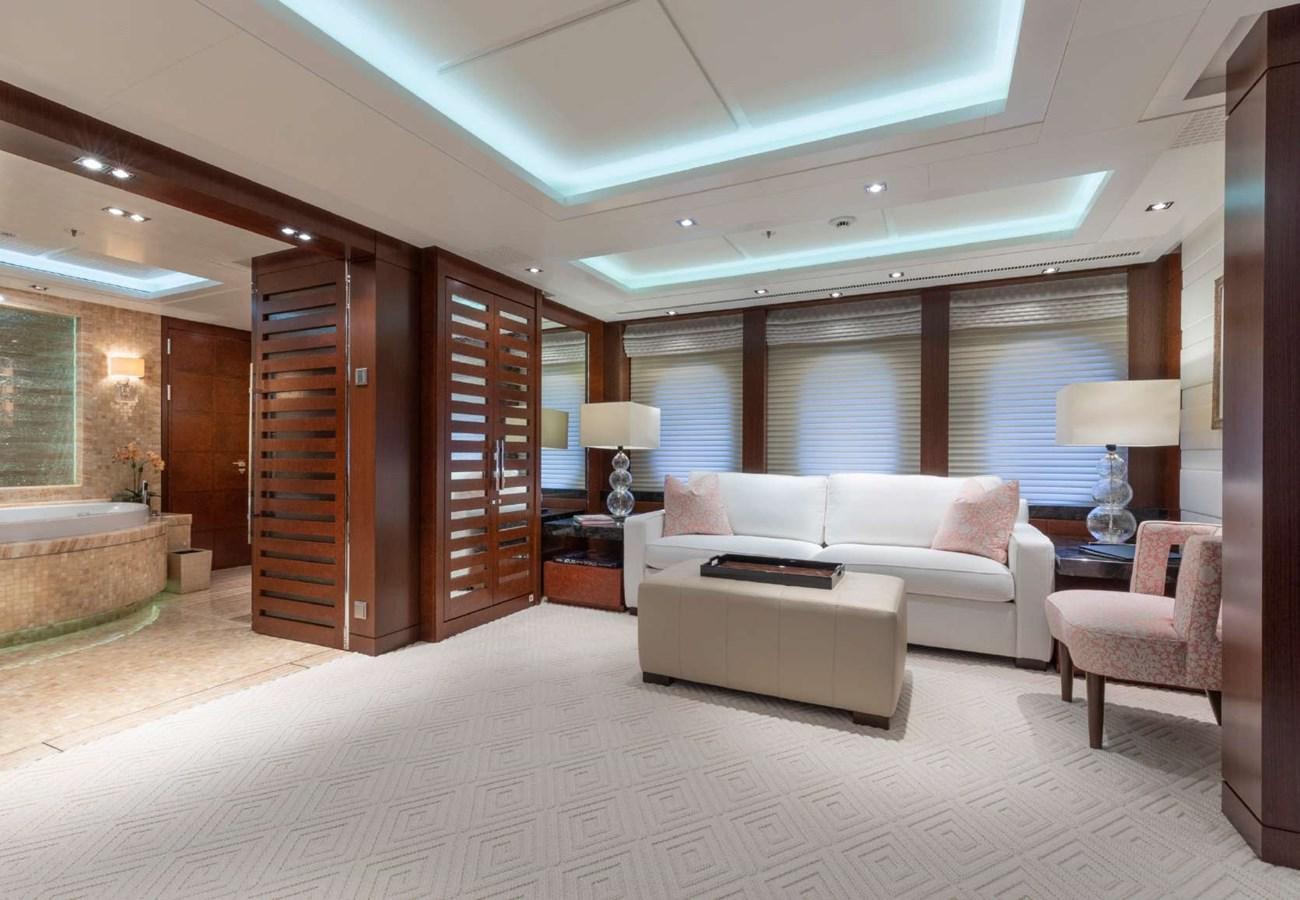 a living room with a large wood cabinet aboard BELLA VITA Yacht for Sale