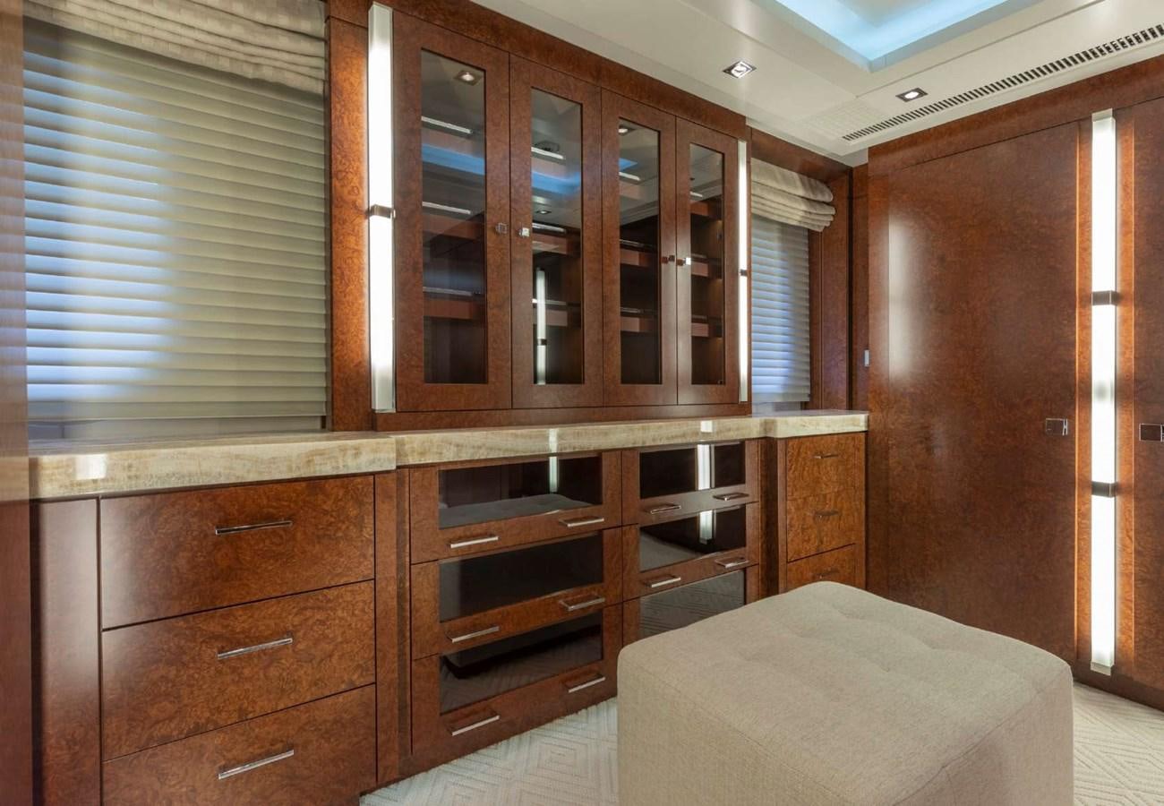 a room with wooden cabinets aboard BELLA VITA Yacht for Sale