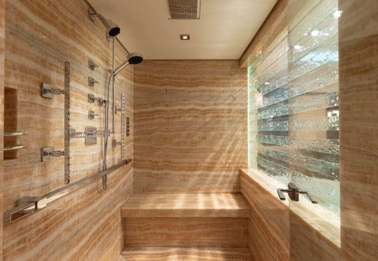 a bathroom with a glass shower aboard BELLA VITA Yacht for Sale