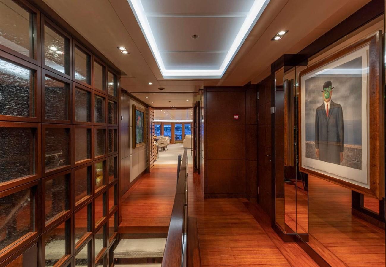 a hallway with glass doors aboard BELLA VITA Yacht for Sale