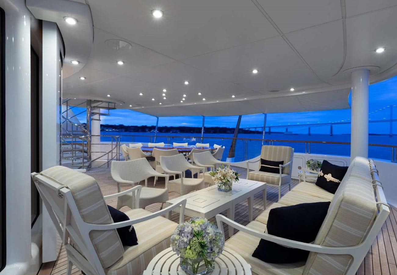 a room with chairs and tables aboard BELLA VITA Yacht for Sale
