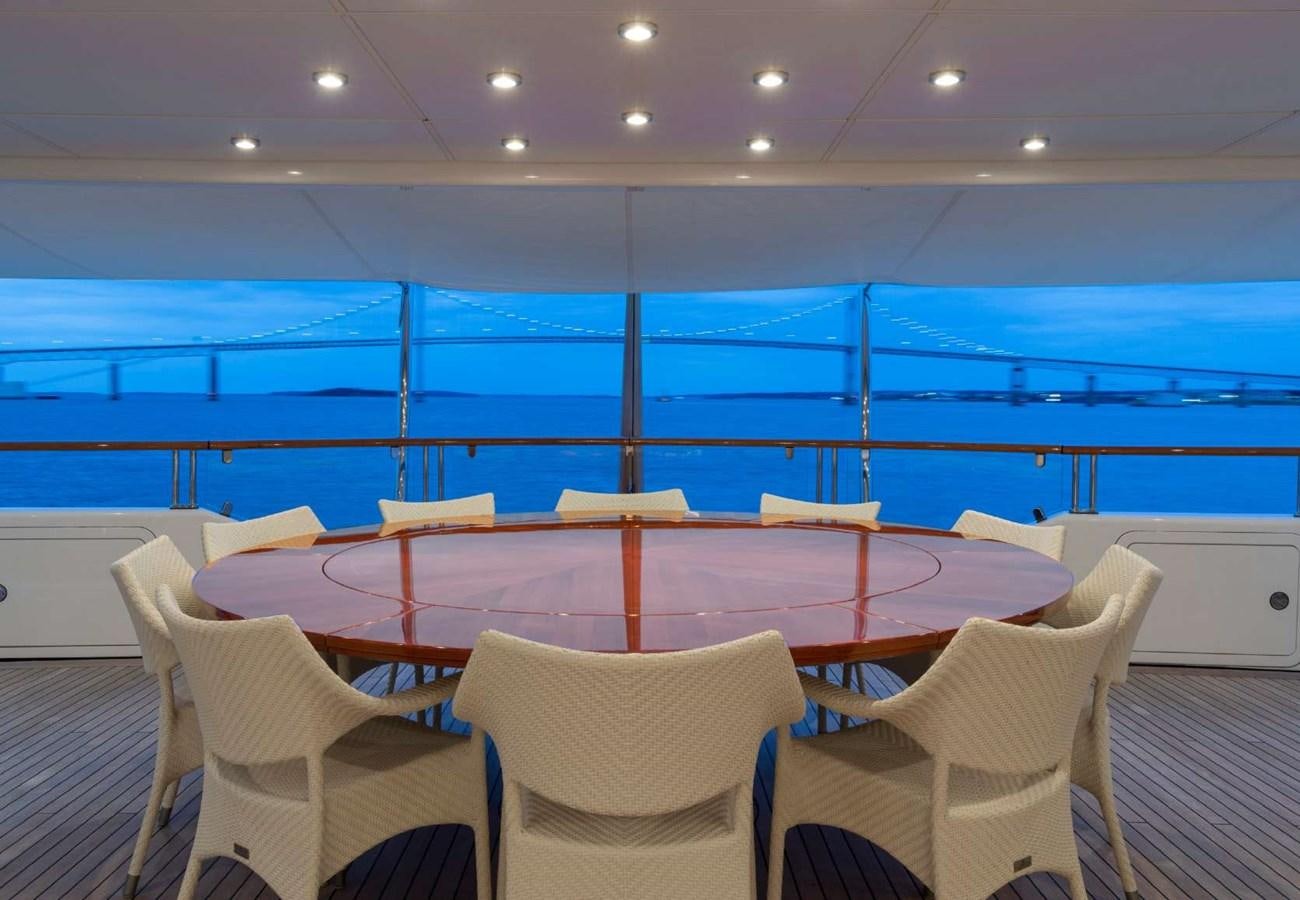 a room with chairs and tables aboard BELLA VITA Yacht for Sale