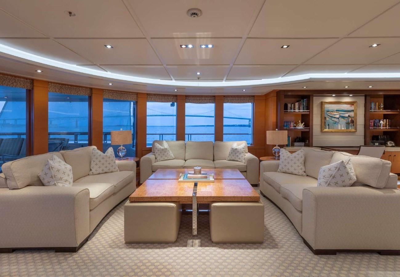 a living room with a couch and a table aboard BELLA VITA Yacht for Sale