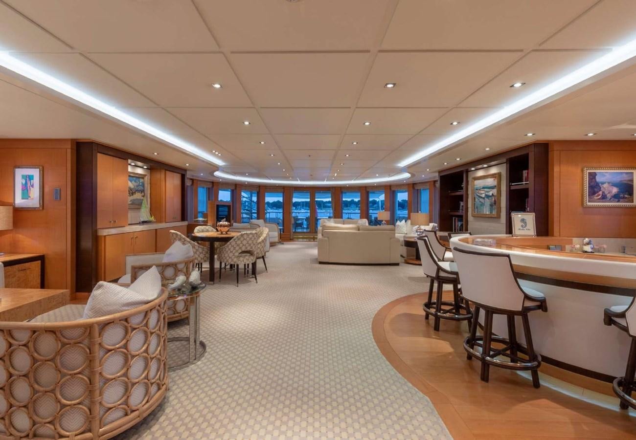 a room with chairs and tables aboard BELLA VITA Yacht for Sale