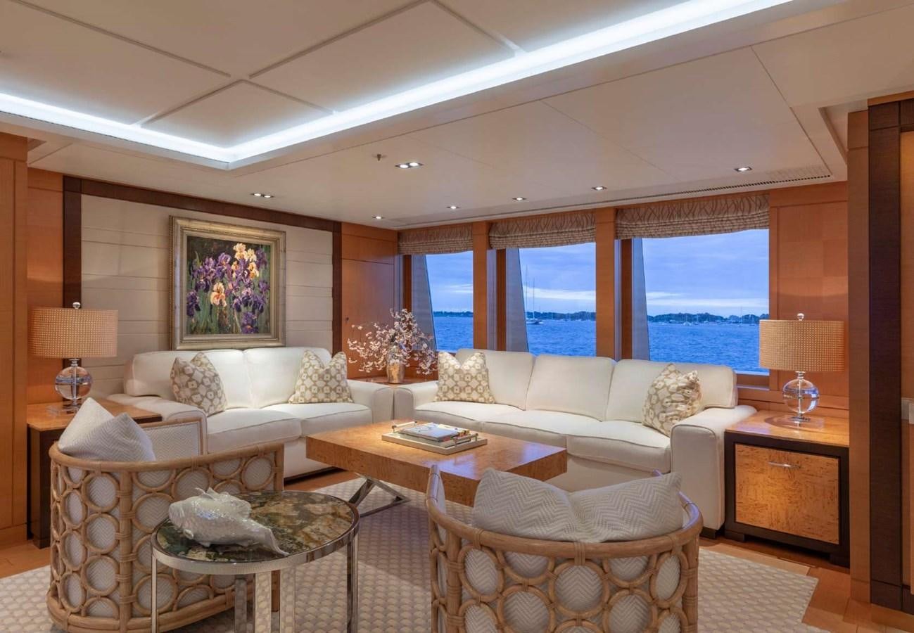 a living room with a large window aboard BELLA VITA Yacht for Sale